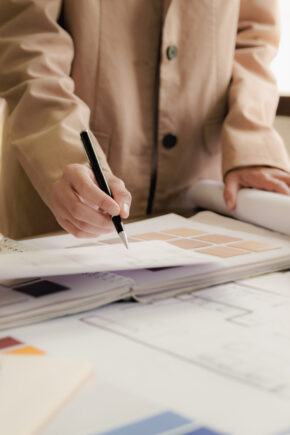 Interior architect working with blueprint planning in modern office, engineering concept.