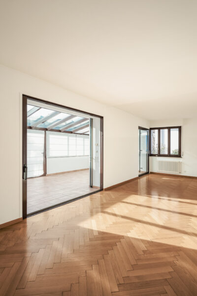 Completely empty room with wooden floors